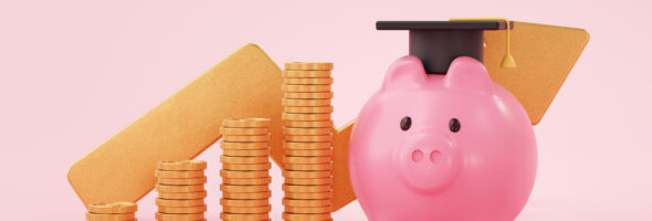 Piggy bank with black graduation hat and coins