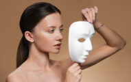 Woman is holding the white mask